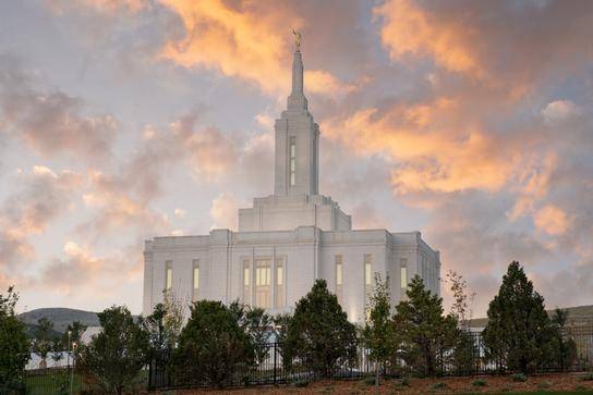 Evening Pocatello Temple picture. The temple is surrounded by darkened trees.