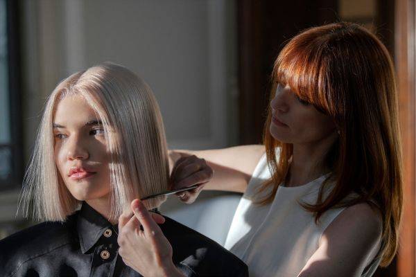woman getting Davines Naturaltech ENERGIZING treatment in a salon