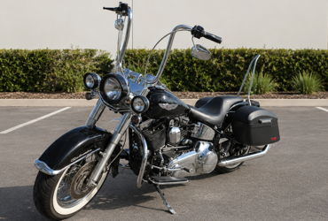 2010 HARLEY-DAVIDSON FLSTN SOFTAIL DELUXE (BLACK) motorcycle for rent near Garden Grove, CA