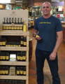 charlie holding a jar of mangrove honey in the store pic