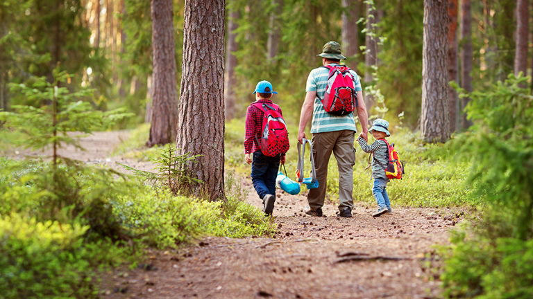 Earth Day - family  walking in forest