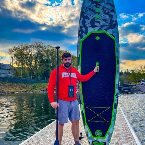 Boy lifts lightweight SUP board in Nova Scotia