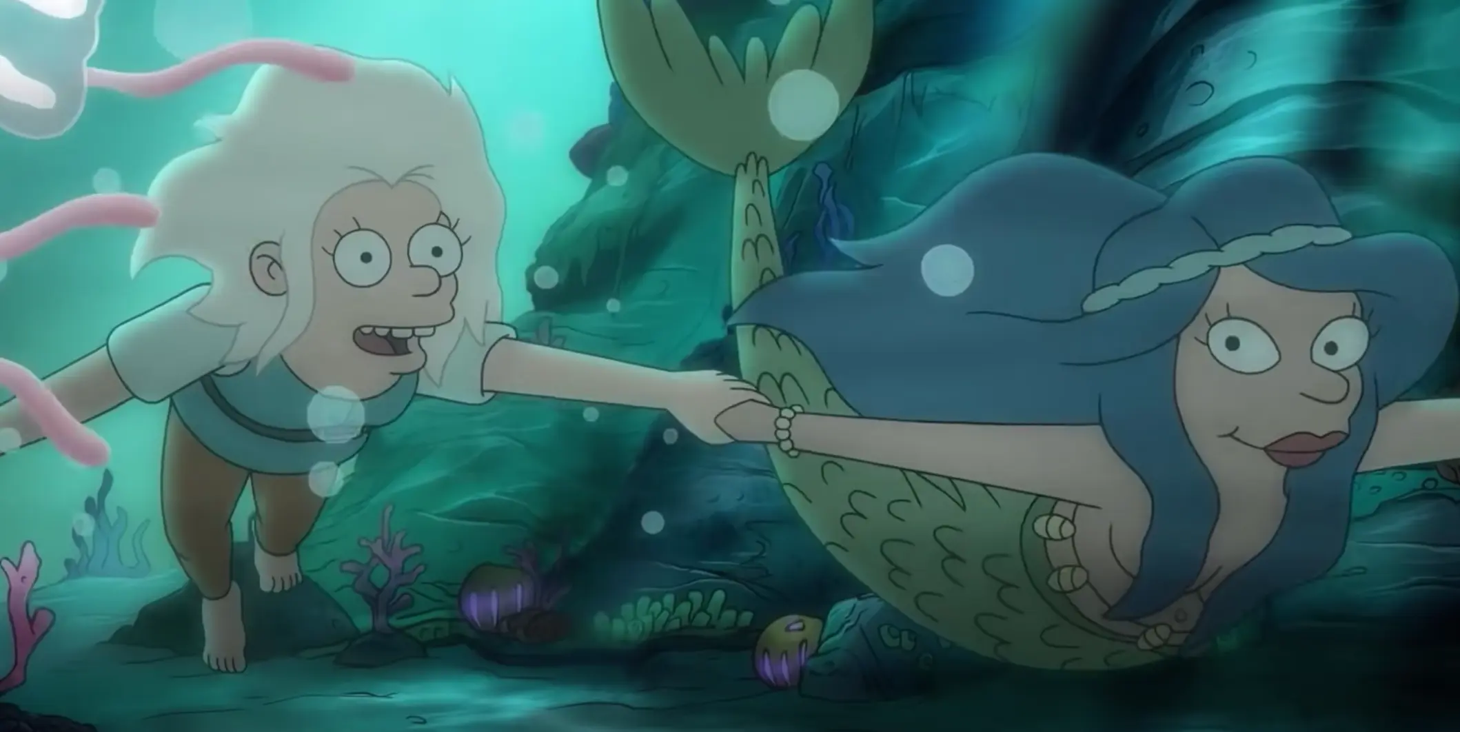 Image of the mermaid Mora leading Princess Bean under the water while smiling and looking at eachother.