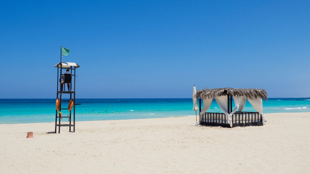 Marsa Matruh, Egypt. Gazebo on the beach. Lifeguard tower. Amazing sea with tropical blue, turquoise and green colors. Relaxing context. Fabulous holidays. Mediterranean Sea. Africa
