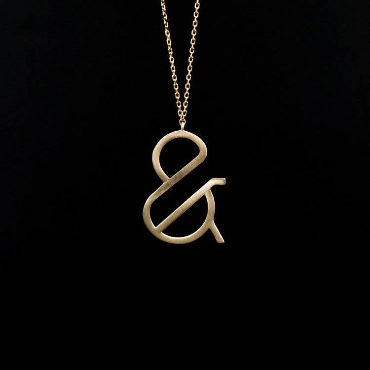 Gold ampersand necklace