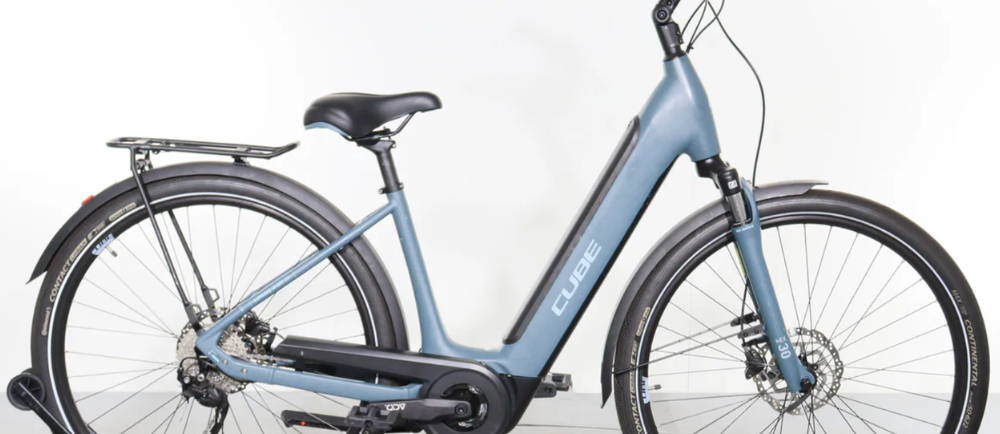 a light blue Cube Supreme Hybrid ONE electric city bike