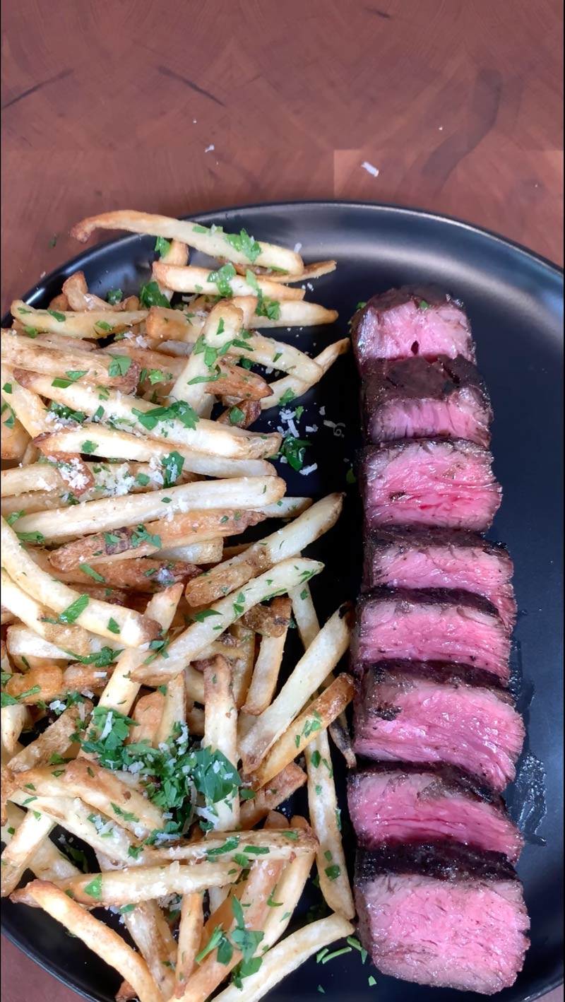 BetterFed Beef Certified ONYA Hanger Steak, Hanging Tender, Butcher's Steak grilled to medium rare and served with homemade parmesan garlic french fries. 