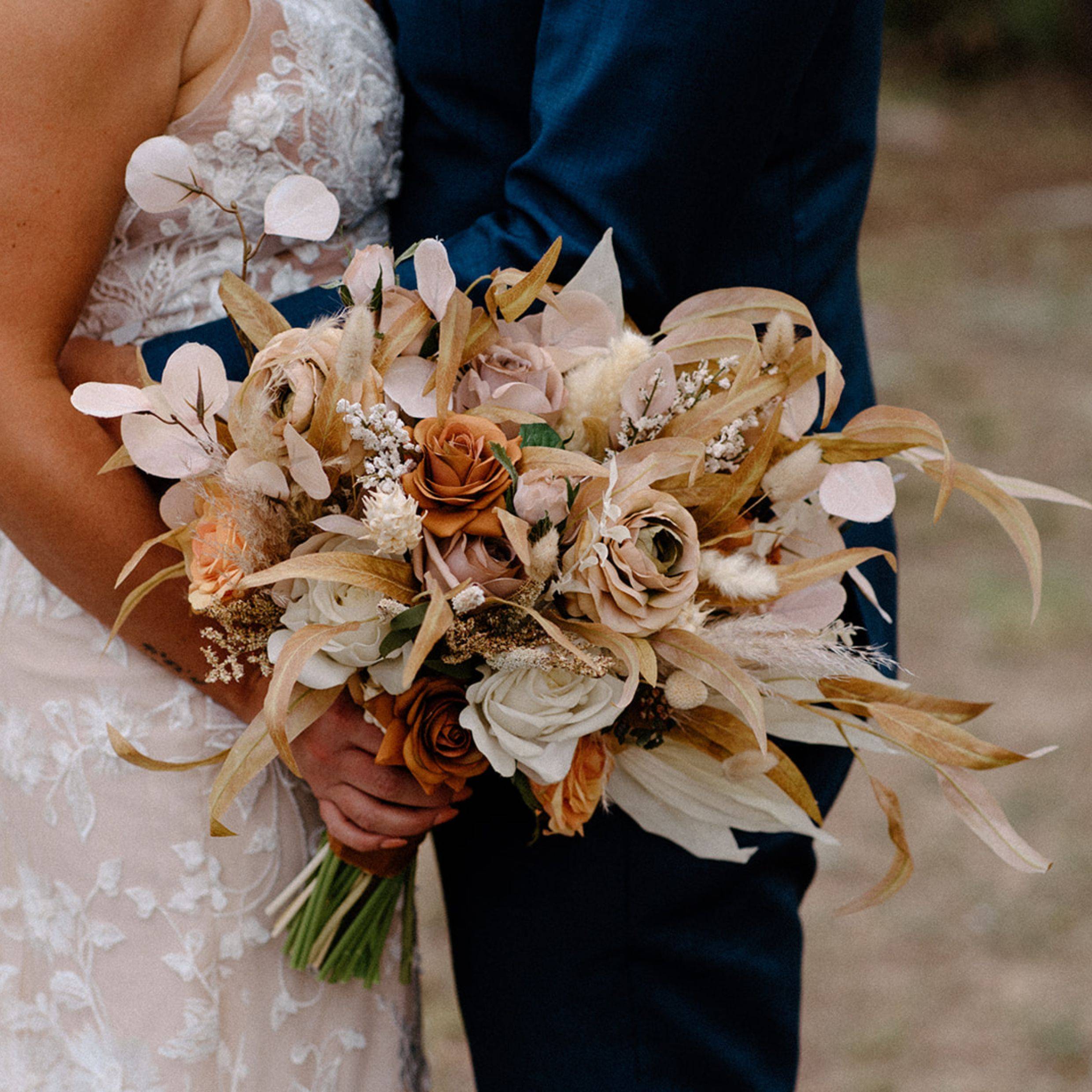 Bohemian bridal bouquet with pampas grass, terracotta roses, and dried flowers