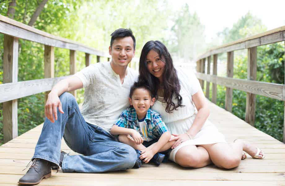 Franchise Owners of Primrose School Sandy and Shi Deng with their son