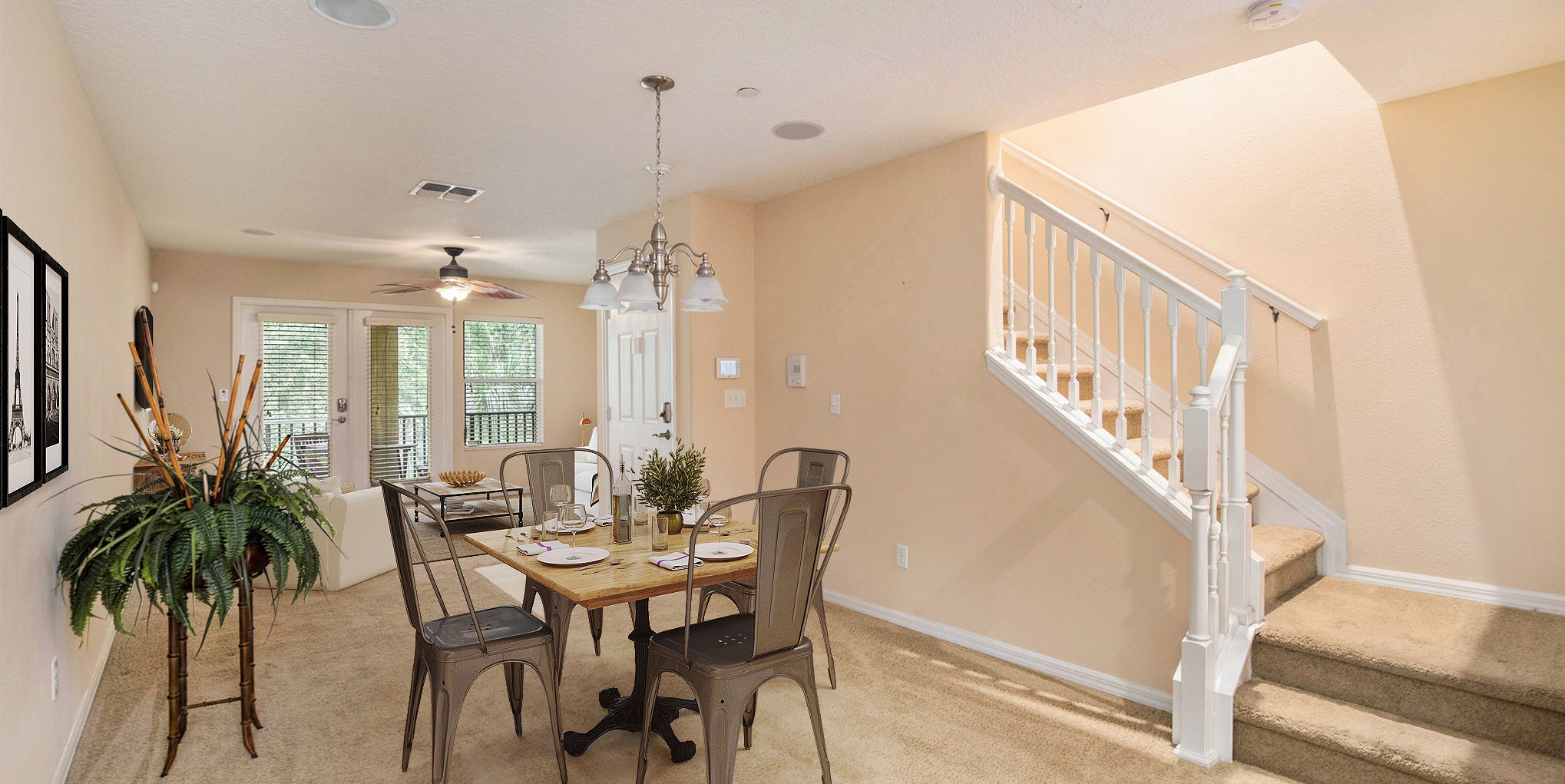 dining area with carpet and a ceiling fan