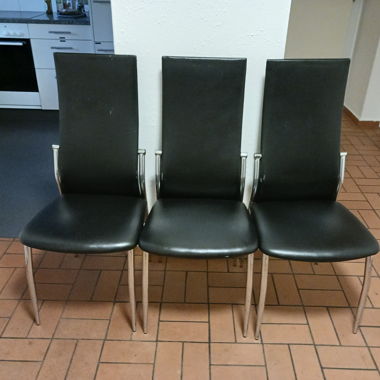 3 black chairs