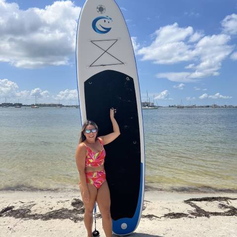 Girl lift lightweight stand up paddle board easily in Canada