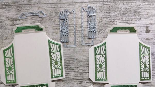 a cut out card with metal cutouts