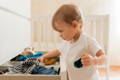 Toddler getting ready alone.