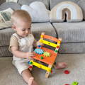 Little boy playing with a Montessori DIY Fun Chair toy.