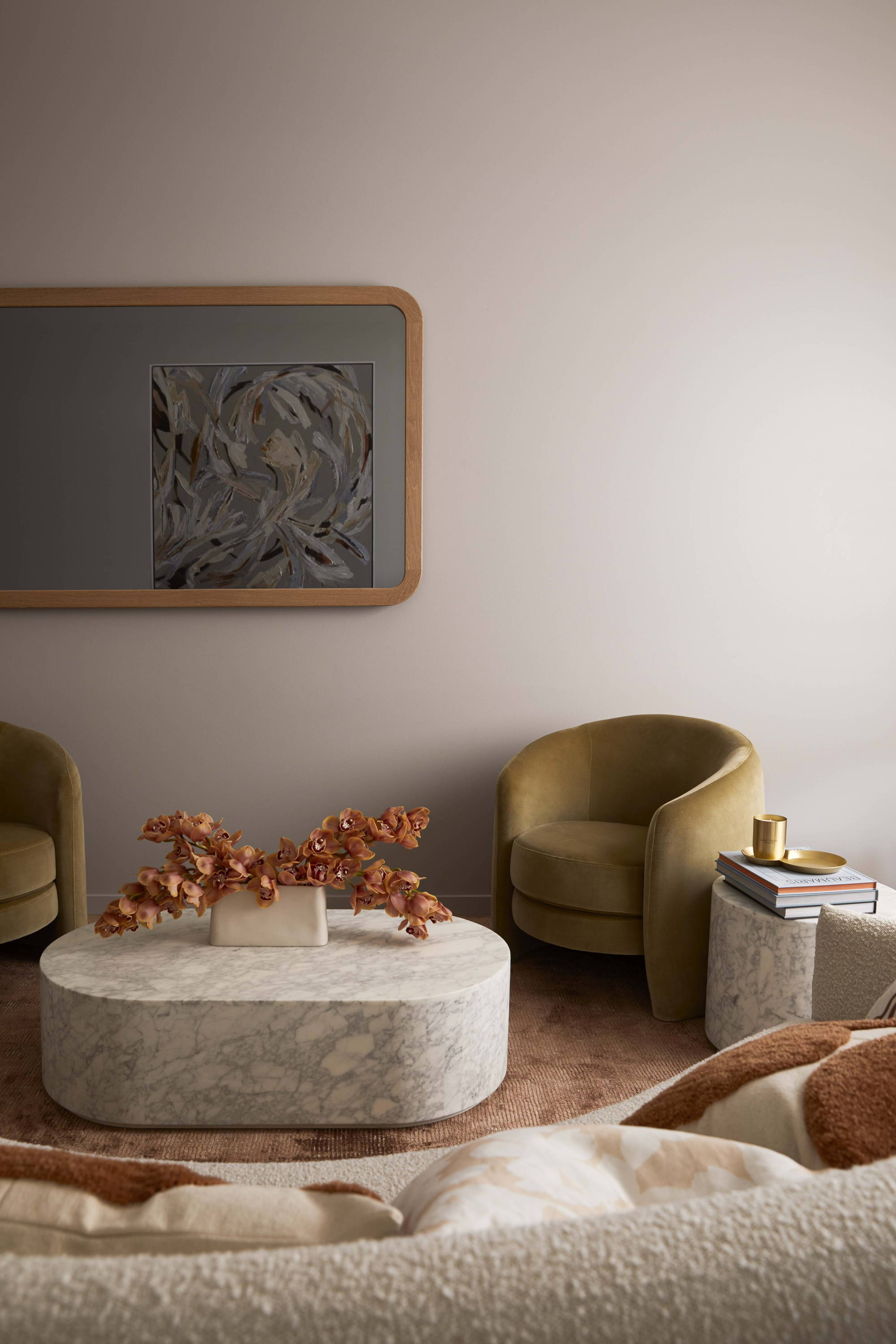 FRAMING TO A T's Contemporary Curve TV-Mirror in Natural Oak Frame styled in a beautiful formal lounge room.