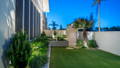 Evening garden scene with soft LED lighting bringing out textures in greenery and hardscape