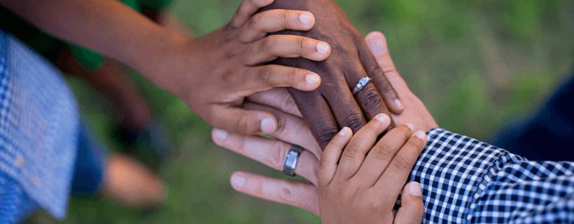 Hands coming together in a gesture of community and support