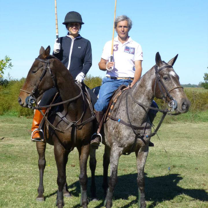 Elizabeth and dear friend sitting atop horses while playing polo.