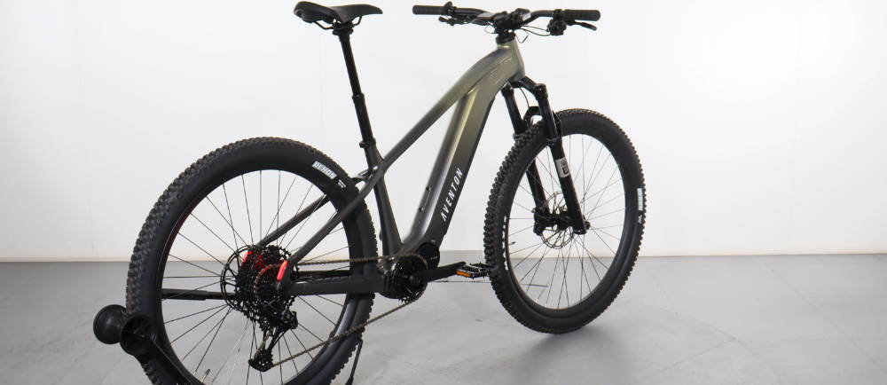 a green aventon ramblas electric mountain bike
