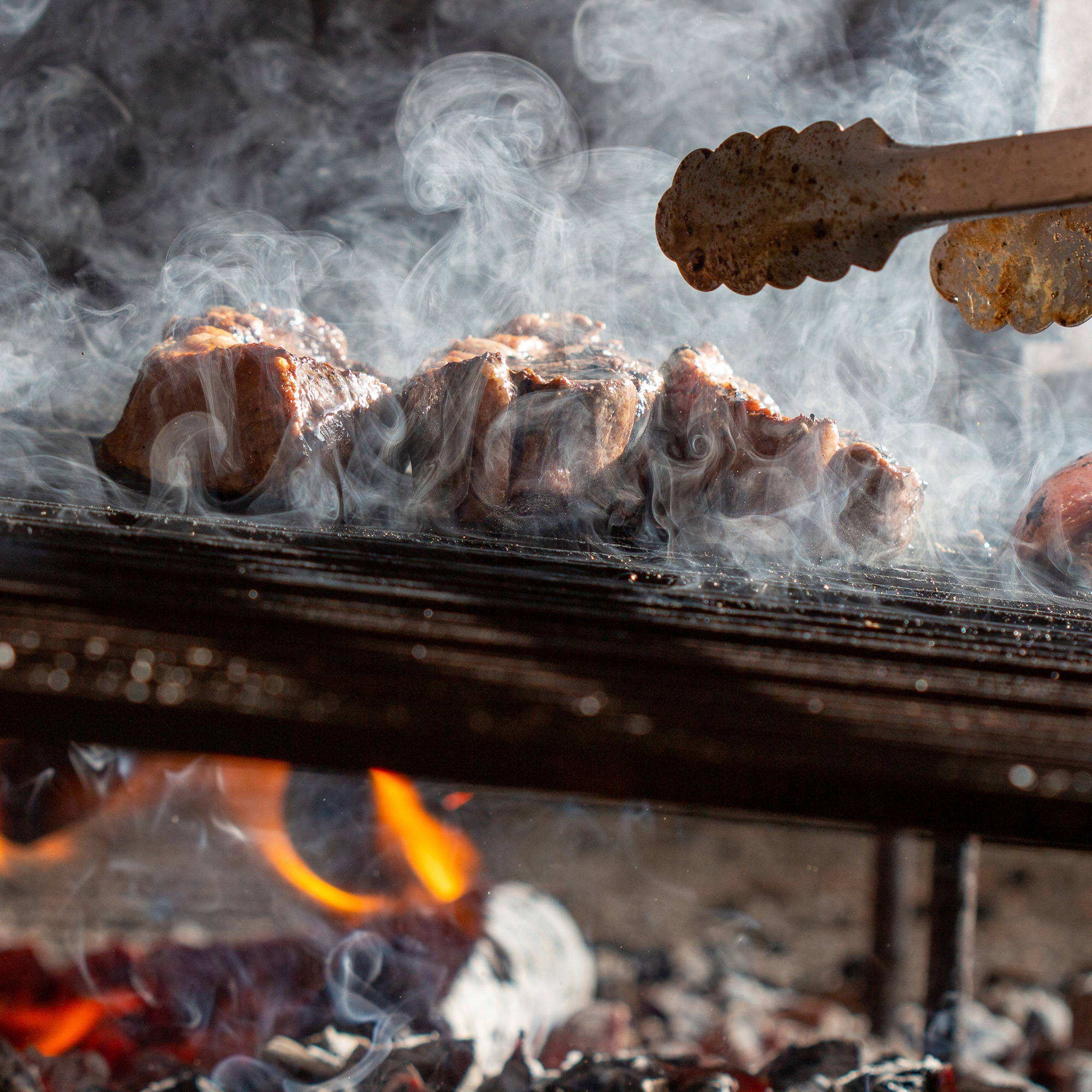 Meat cooking on a BBQ Grill