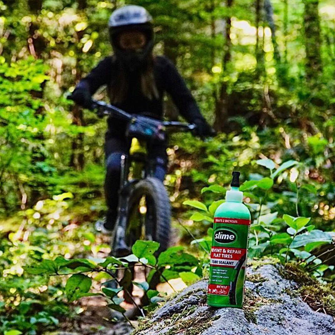 Mountain Biker in Forest with Slime Tube Sealant