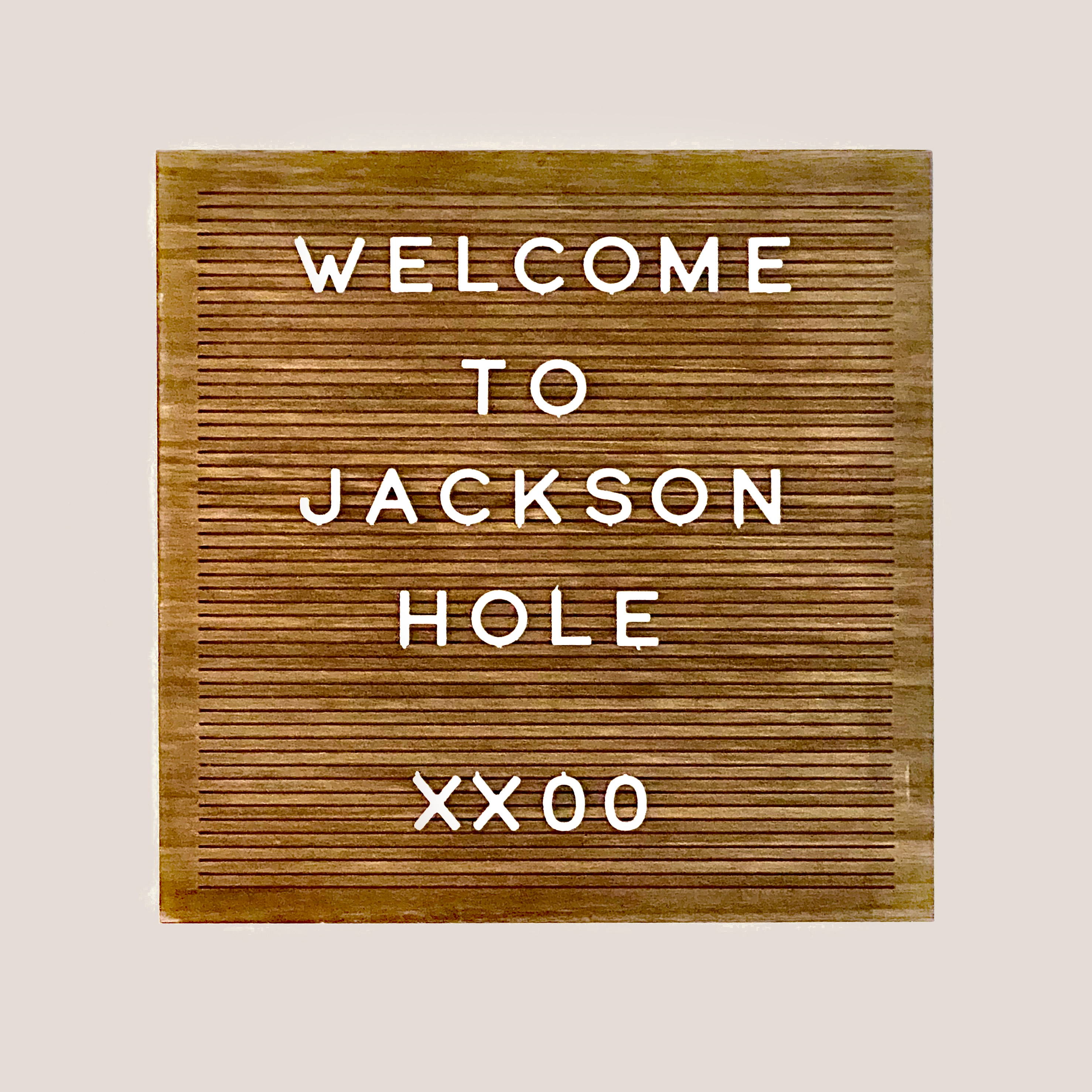 A sign with message "Welcome to Jackson Hole" 