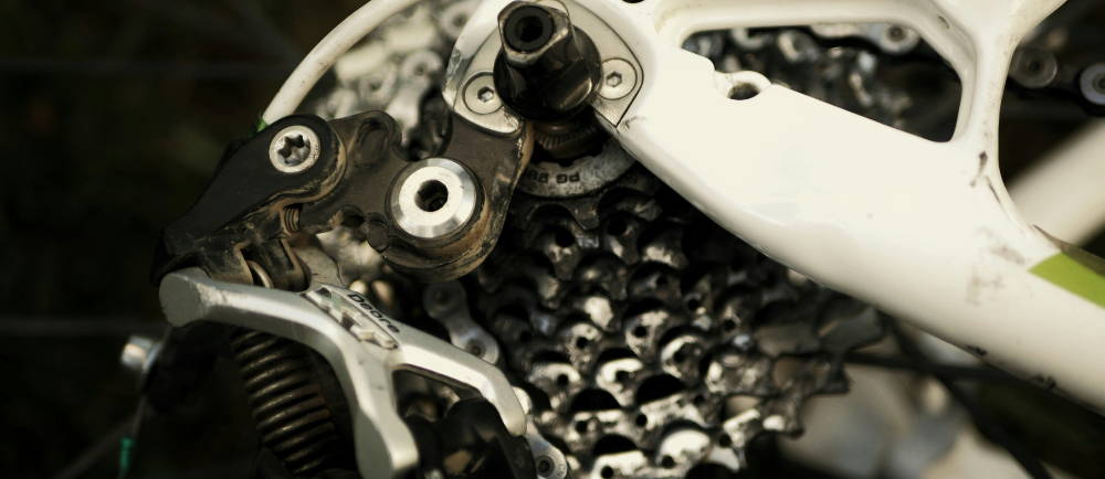 a corroded shimano Derailleur and rear cassette on an electric mountain bike