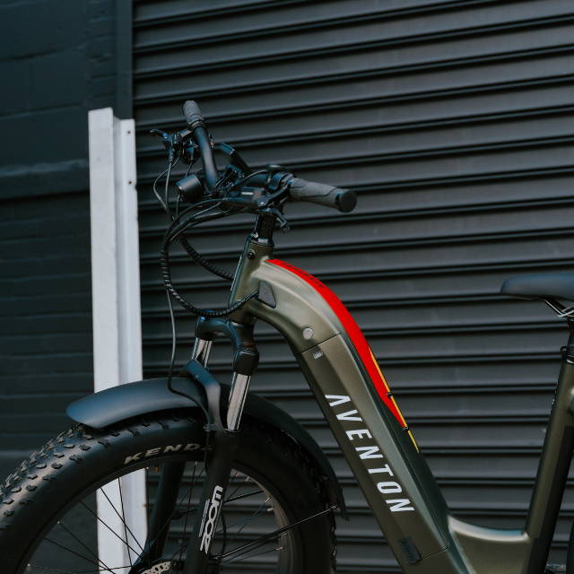 a green aventon aventure electric fat tire bike