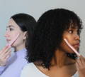 two women holding face razor for skin exfoliation
