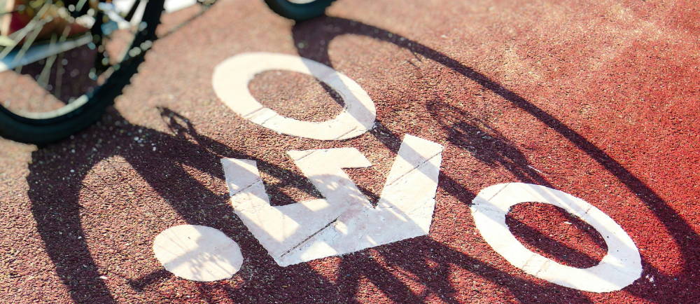 Bike symbol painted on road with bike shadow