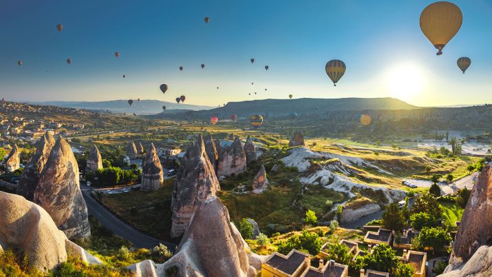 Balloon rides provide breathtaking panoramic views of Cappadocia's fairy chimneys, unique rock formations, and ancient cave dwellings, creating a mesmerizing vista