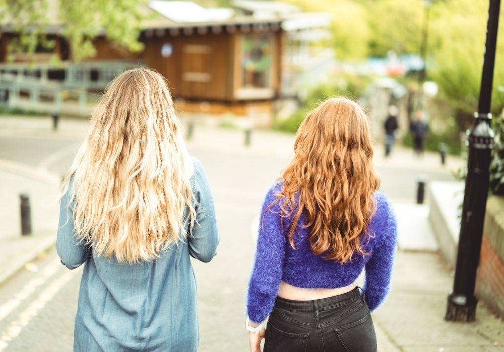 Image of wavy hair women on beach