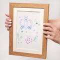 Cute child's drawing of animals and insects kept in a wooden Keepsake Frame. 