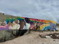 cleaning graffiti from a mural