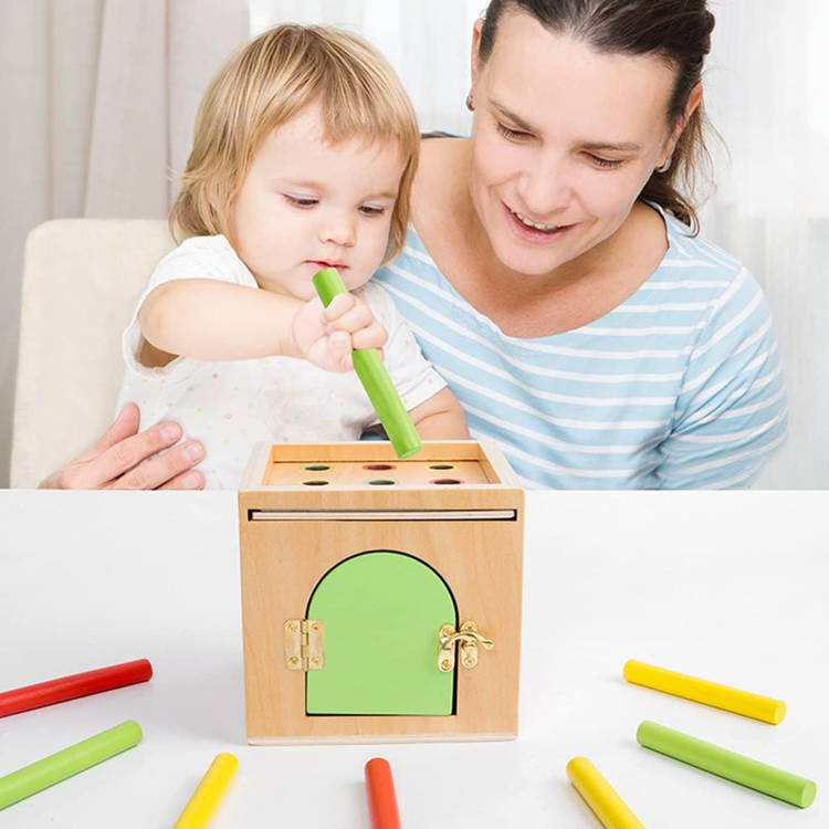 Mother and toddler playing with a colorful wooden Montessori shape sorting toy.