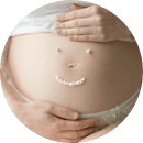 A waist training corset or postpartum girdle can help