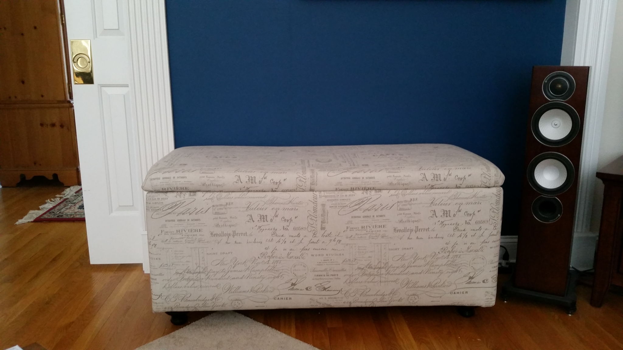 Ottoman encloses subwoofer