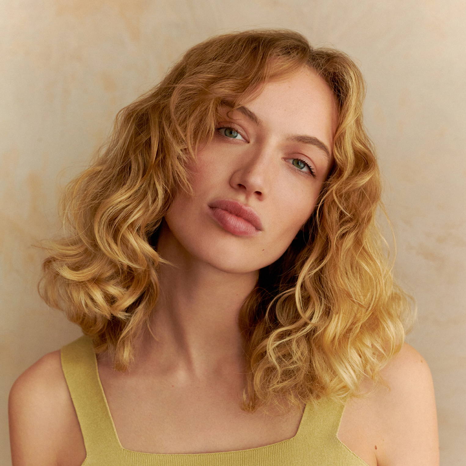 Davines hair model with golden blonde hair