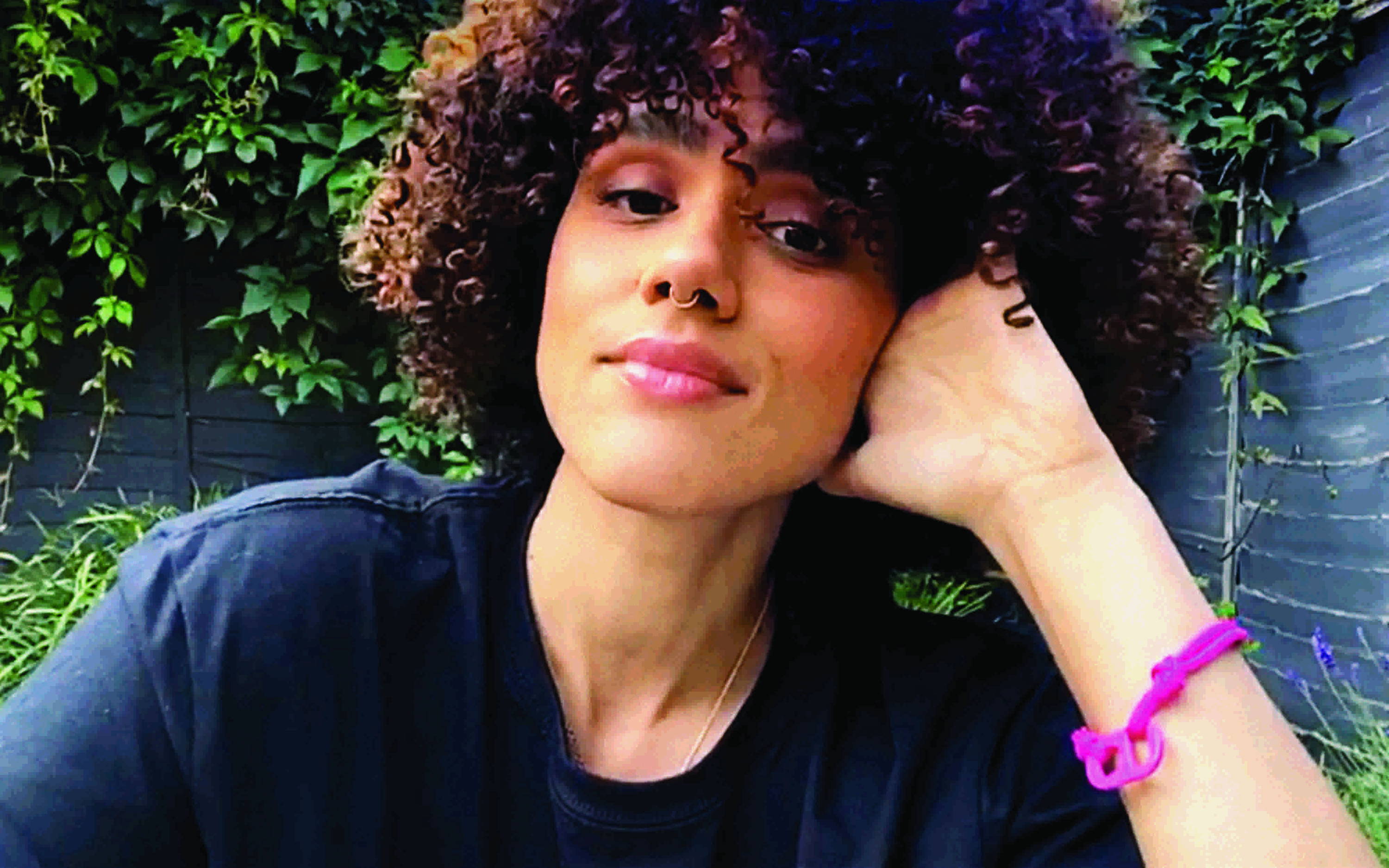 The actress Nathalie Emmanuel wears a Goal 10: Reduced Inequalities #TOGETHERBAND