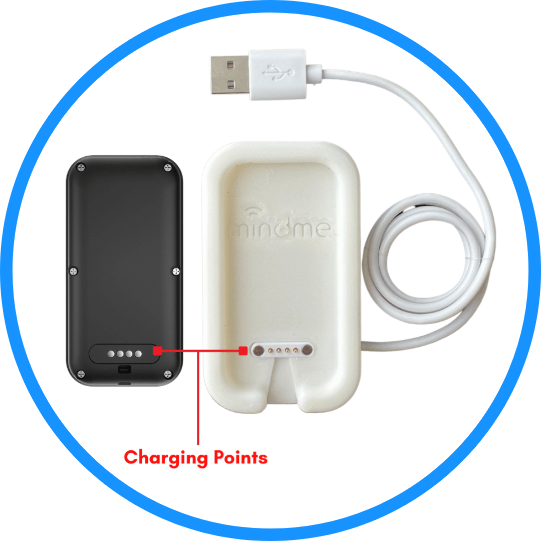 Charging dock and charger for the MindMe Pro SM SOS pendant, showing the back of the pendant and how to align the charging points. Text reads: 'Align the dots on the back of the MindMe Pro SM with those on the charging base, and place the device on the charging base.' Ensures proper charging for the SOS alarm, providing long life battery and reliable emergency assistance.