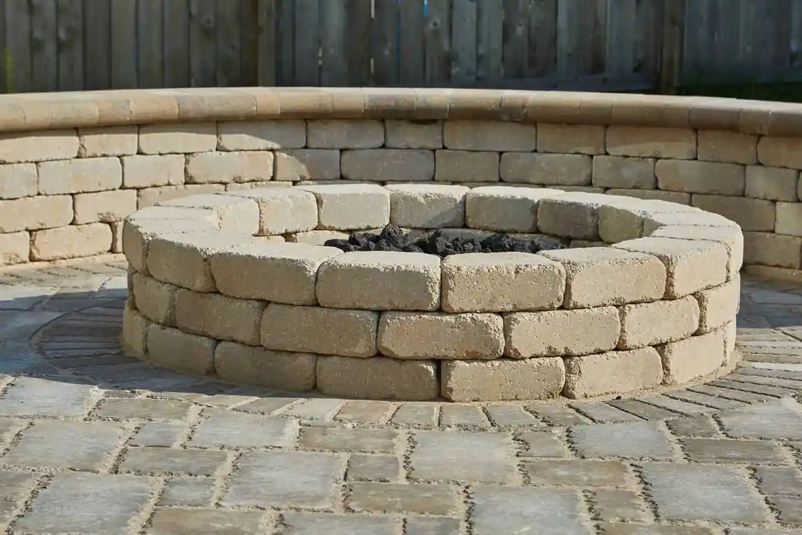Curved Retaining wall and fire pit both made with Summit Wall Tapered Blocks