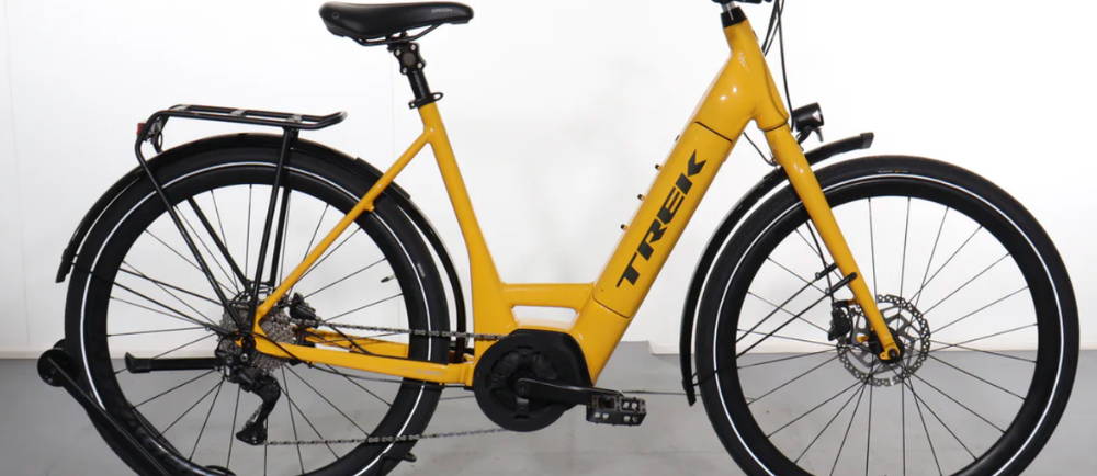 a yellow Trek Verve+ 4S