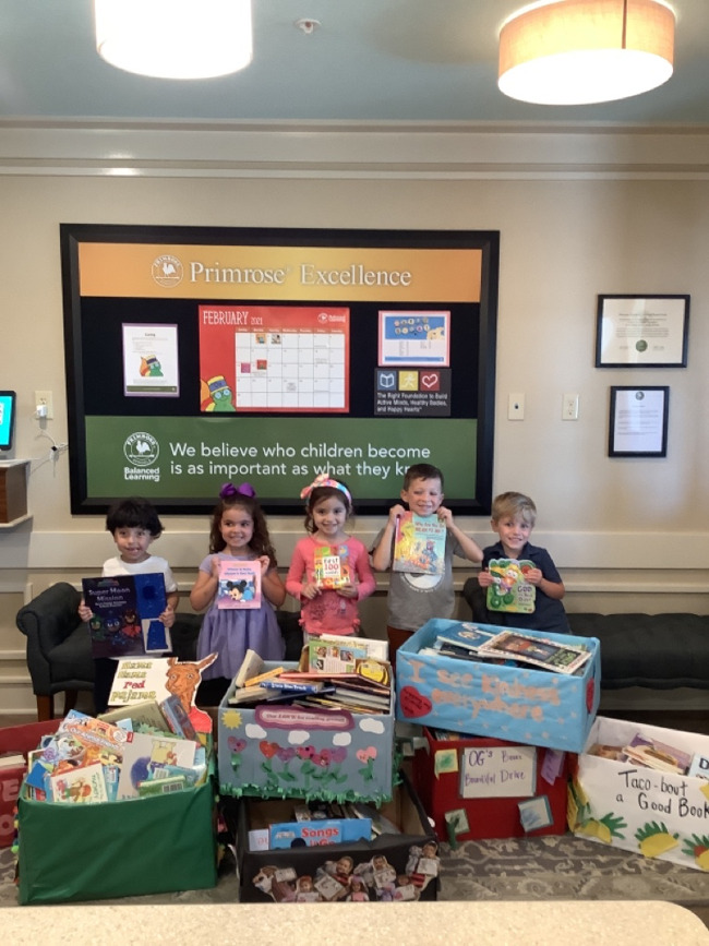 Primrose students posing with donated books