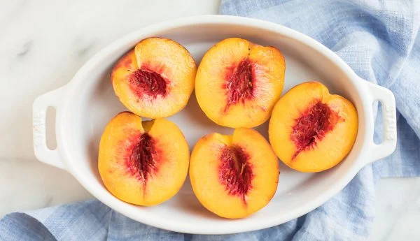 peaches contain too much sugar for dogs