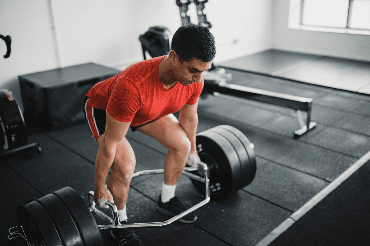 athlete in gym with trap bar athlete in gym with trap bar