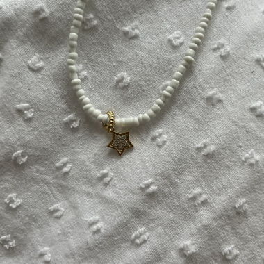 white necklace with gold star