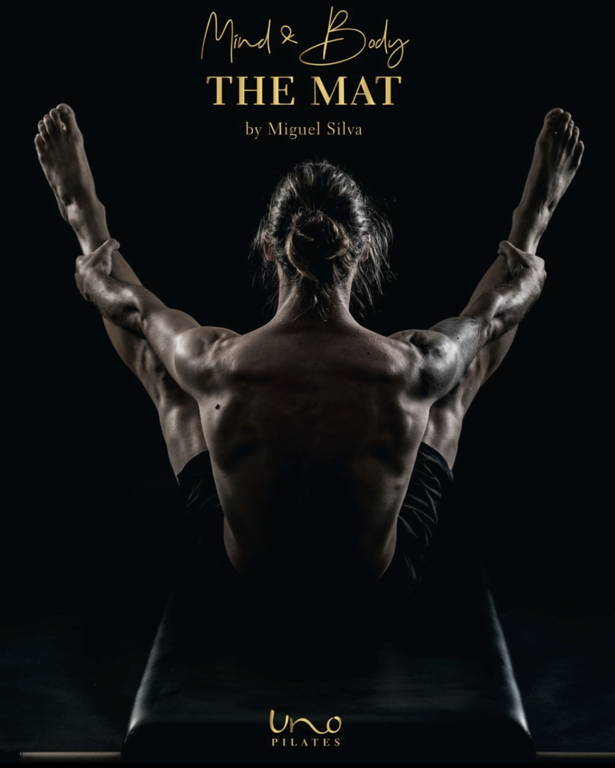Miguel Silva on the Reformer, doing an exercise. Cover Page.