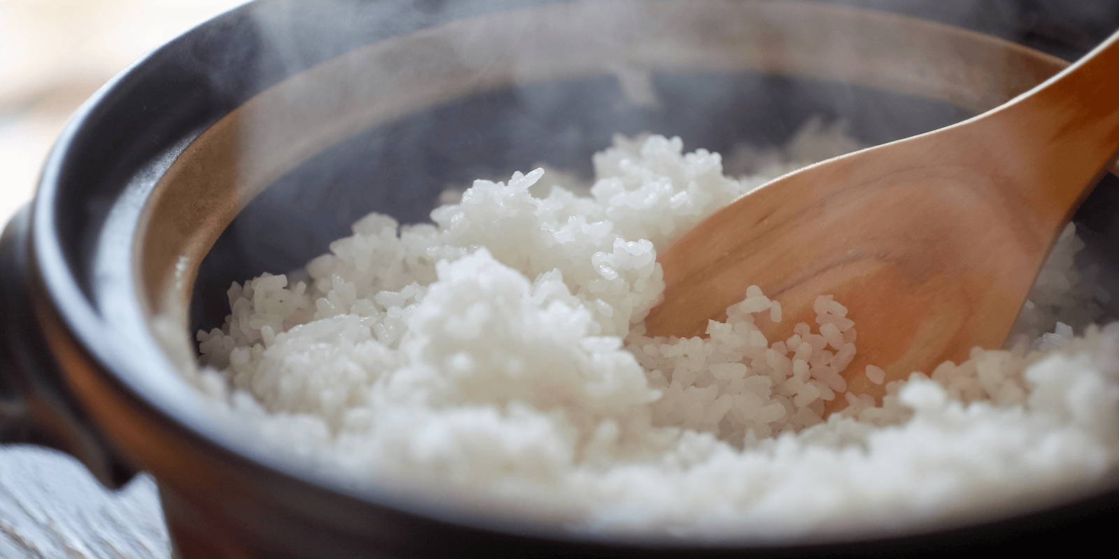 Steaming rice in a pot.