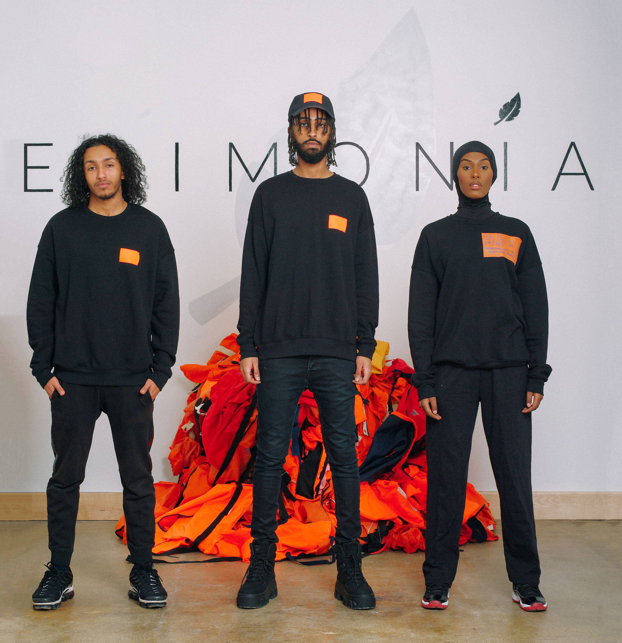 Refugee Models Wearing Epimonia Life Jacket Sweatshirts and Hats